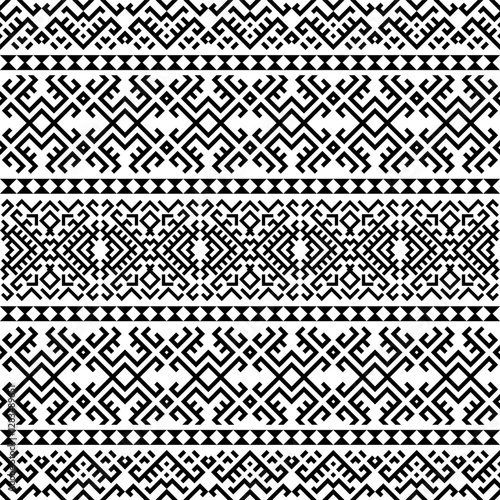 A striking seamless pattern featuring bold, repeating geometric shapes in black and white. Inspired by ancient tribal motifs, ideal for textiles, home decor, and digital designs.