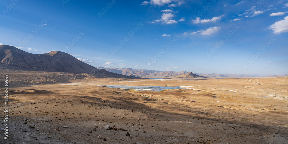 Scenic sunset mountain landscape view of high-altitude Tuzkul salt lake along Pamir Highway between Bulunkul and Alichur, Gorno-Badakhshan, Tajikistan Scenic sunset mountain landscape view of high-altitude Tuzkul salt lake along Pamir Highway between Bulunkul and Alichur, Gorno-Badakhshan, Tajikistan