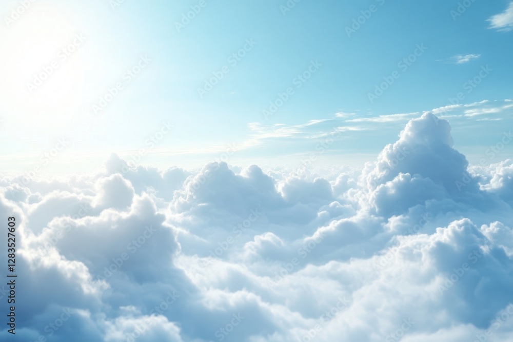 Fototapeta premium Cloudscape bathed in sunlight shining over soft white clouds in a clear blue sky