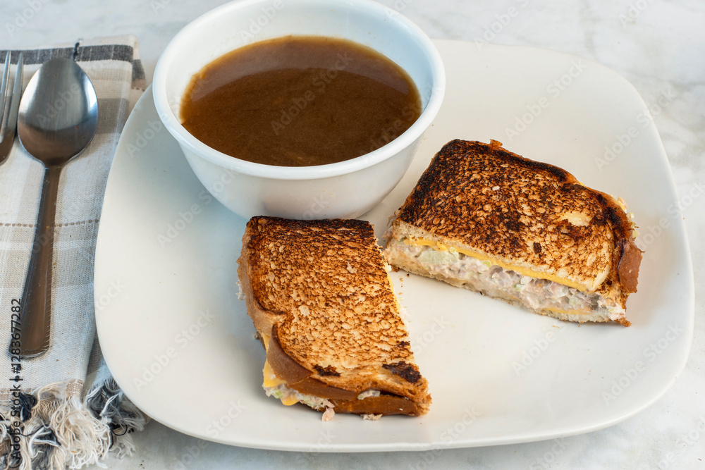 bowl of french onion soup with a tuna melt bowl of french onion soup with a tuna melt