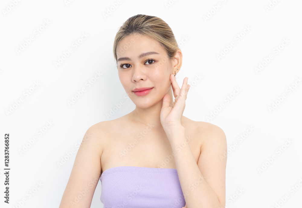 Skin care. Woman with beauty face touching healthy facial skin portrait. Beautiful smiling asian girl model with natural makeup touching glowing hydrated skin on white background Skin care. Woman with beauty face touching healthy facial skin portrait. Beautiful smiling asian girl model with natural makeup touching glowing hydrated skin on white background