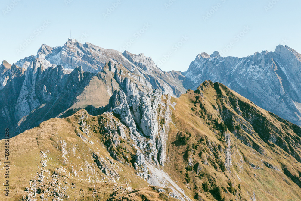 Rugged Alpine Peaks of the Swiss Alps Under a Clear Blue Sky, Alpstein, Säntis, Switzerland Rugged Alpine Peaks of the Swiss Alps Under a Clear Blue Sky, Alpstein, Säntis, Switzerland