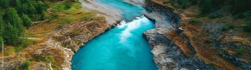 Aerial View of Turquoise River Flowing Through Rocky Landscape Aerial View of Turquoise River Flowing Through Rocky Landscape