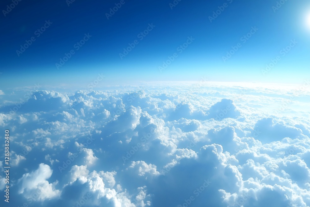 Fototapeta premium Aerial View of Dense Fluffy Clouds under a Clear Blue Sky with Sunlight Illuminating the Scene Creating a Serene and Expansive Visual Landscape