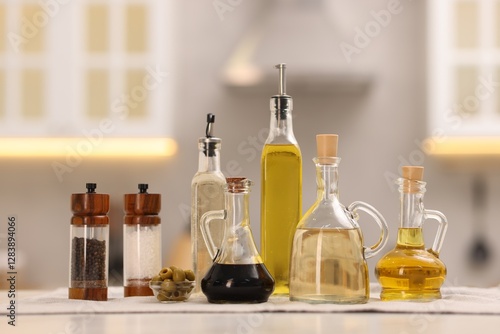 Wallpaper Mural Bottles of salad dressings, salt, pepper and olives on white table in kitchen Torontodigital.ca