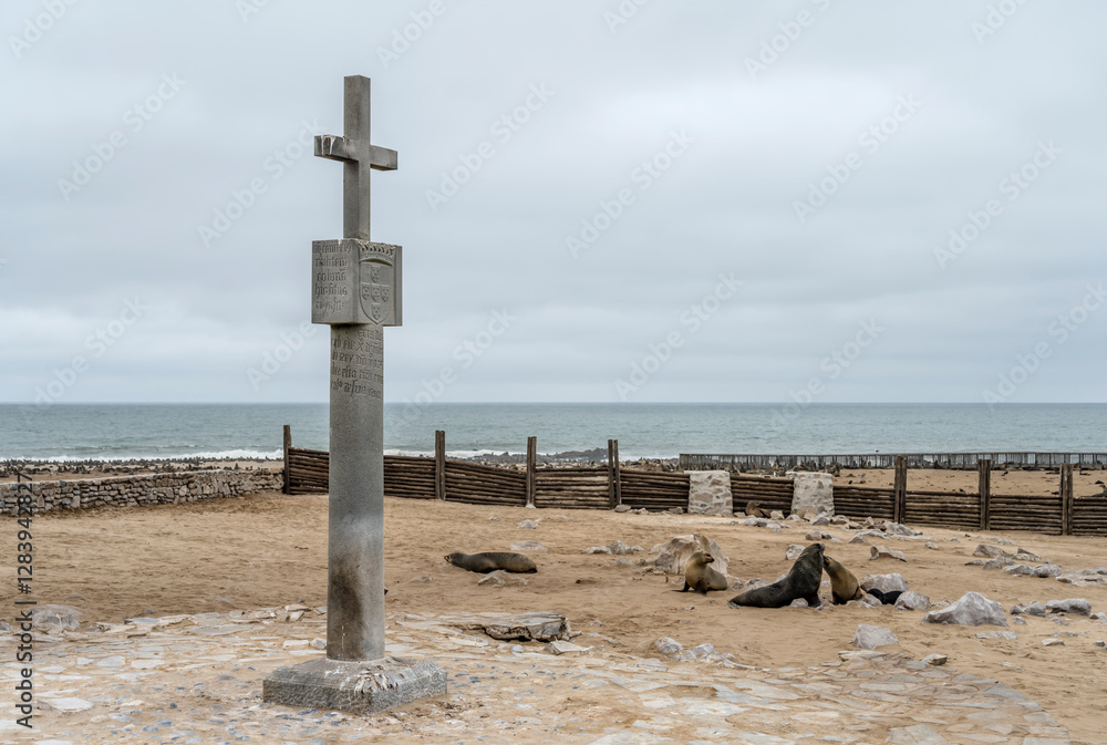memorial stone cross and seals at historical site, Cape Cross, Namibia