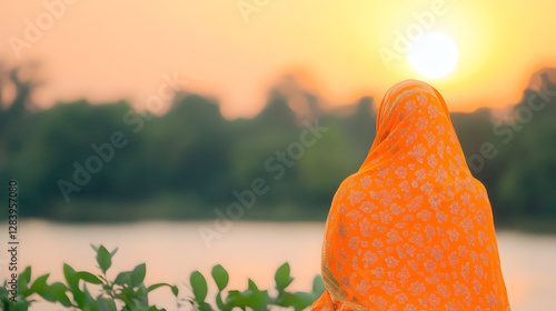 Boishakhi: A Vibrant Orange and Gold Bangladeshi Saree Worn by a Woman
 photo