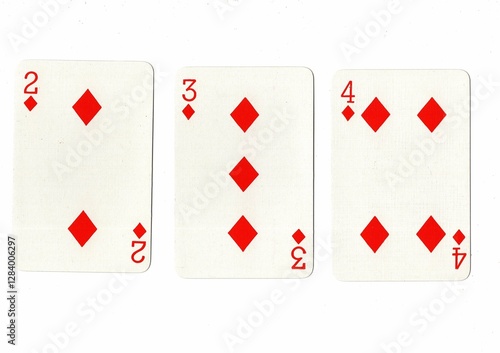 Photography A hand of playing cards showing a run of three in the same suit.