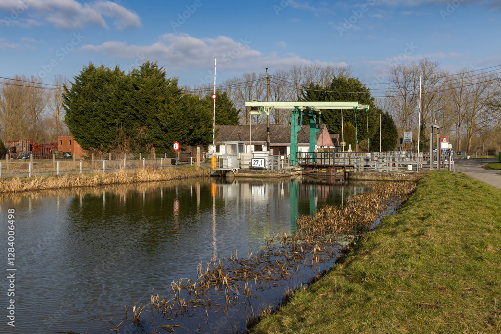 Winter view of the Dender bridge and Sluice gate at Idegem on the River Dender near Ninove, in East Flanders, Belgium. Winter view of the Dender bridge and Sluice gate at Idegem on the River Dender near Ninove, in East Flanders, Belgium.