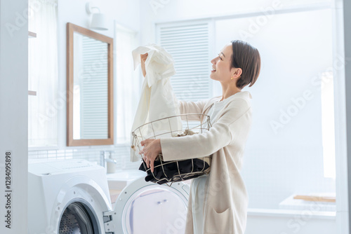 Fotografie 洗濯をする女性
