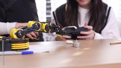 Curious children exploring STEM learning in a vibrant school classroom, building robots and discovering engineering concepts through hands-on projects and teamwork with friends