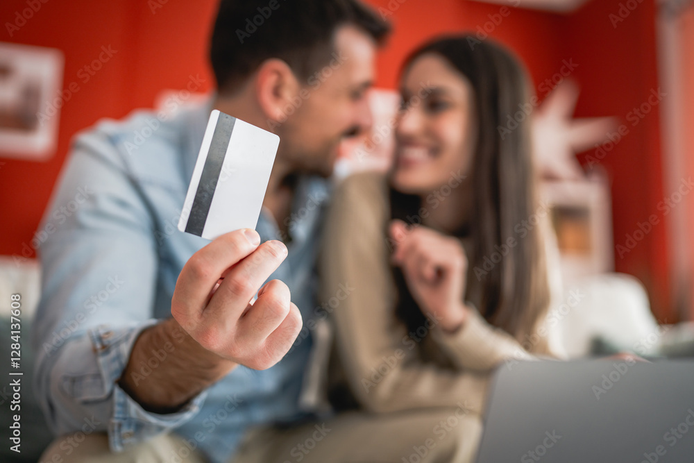 close up on man hand hold credit card for online shopping at home close up on man hand hold credit card for online shopping at home