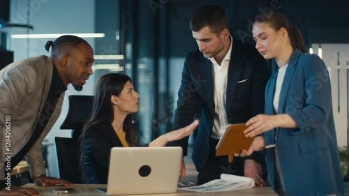 Diverse business team engaged in discussion during a meeting in a modern office. Concept of teamwork, corporate strategy, and professional collaboration in a contemporary workspace