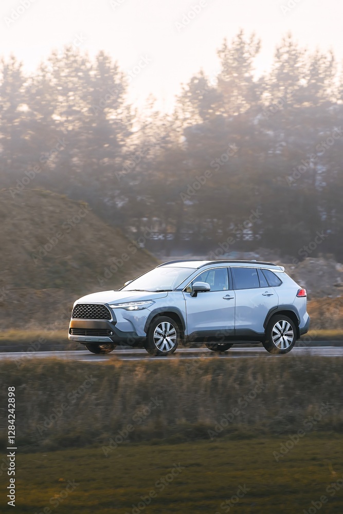 Vehicle cruising through a serene rural area Vehicle cruising through a serene rural area