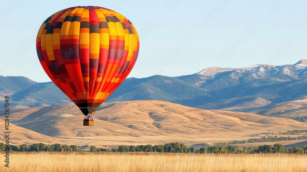 Fototapeta premium Colorful Hot Air Balloon Floating Over Serene Landscape in Daylight