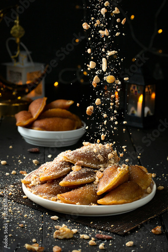 nuts Qatayef dessert, Middle East dessert, month of Ramadan.  photo