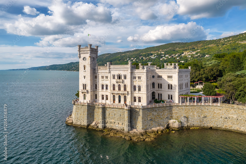 Naklejka premium Aerial view of the Miramare Castle at the Adriatic sea coast in Italy