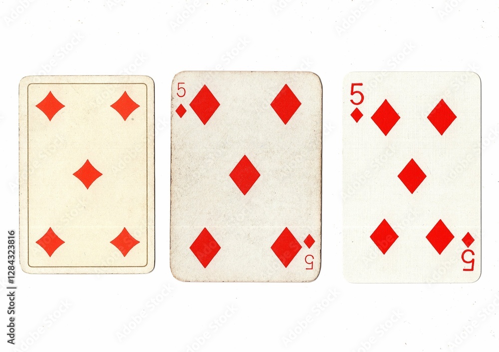 Obraz premium Vintage playing cards in three different designs showing the same value.