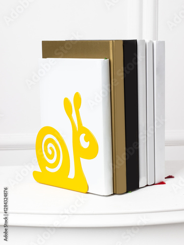 Book stand in the form of a yellow snail