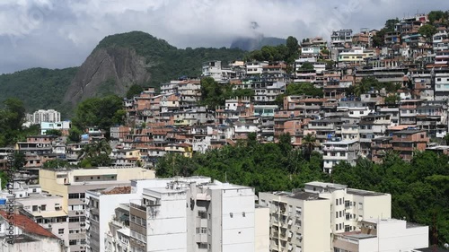 Favela de rioa at dawn with the famous Christ the Redeemer in the background