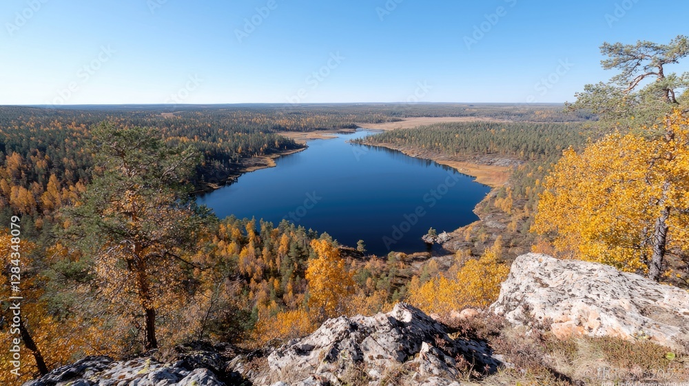 Autumn lake view from rocky peak, golden forest Autumn lake view from rocky peak, golden forest