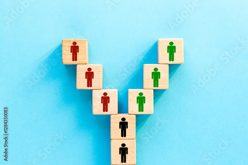 Obraz na płótnie Good or bad choice. People symbols on wooden dice splitting in different directions, Symbol of following the right or wrong path. Making right or wrong decisions, blue background, copy space w salonie