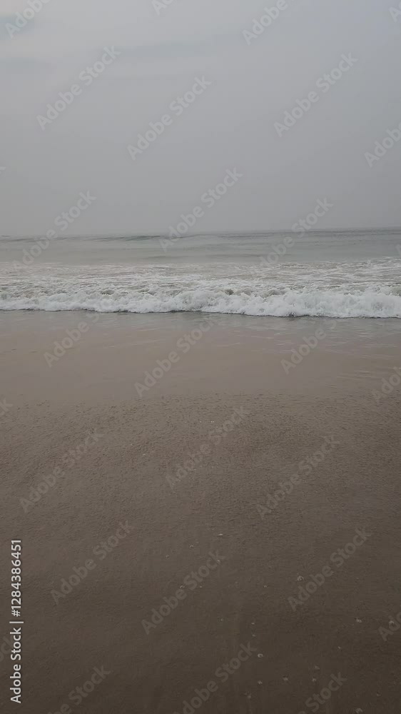 Scenic view of waves rushing at sandy beach against sky during sunset. High quality Full HD footage. Scenic view of waves rushing at sandy beach against sky during sunset. High quality Full HD footage.