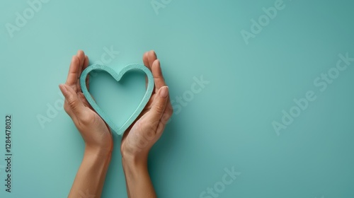 Tender Hands Protecting a Teal Heart: A Symbol of Care and Compassion