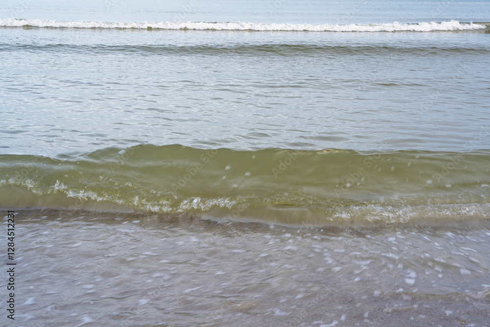 Sandy shore of the Baltic Sea with waves Sandy shore of the Baltic Sea with waves