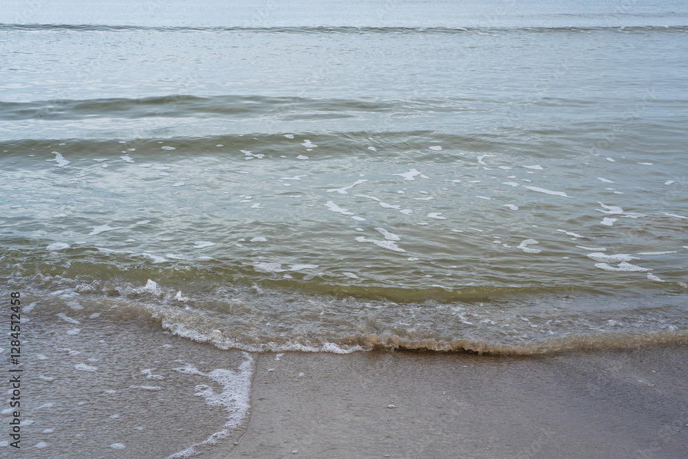 Sandy shore of the Baltic Sea with waves Sandy shore of the Baltic Sea with waves