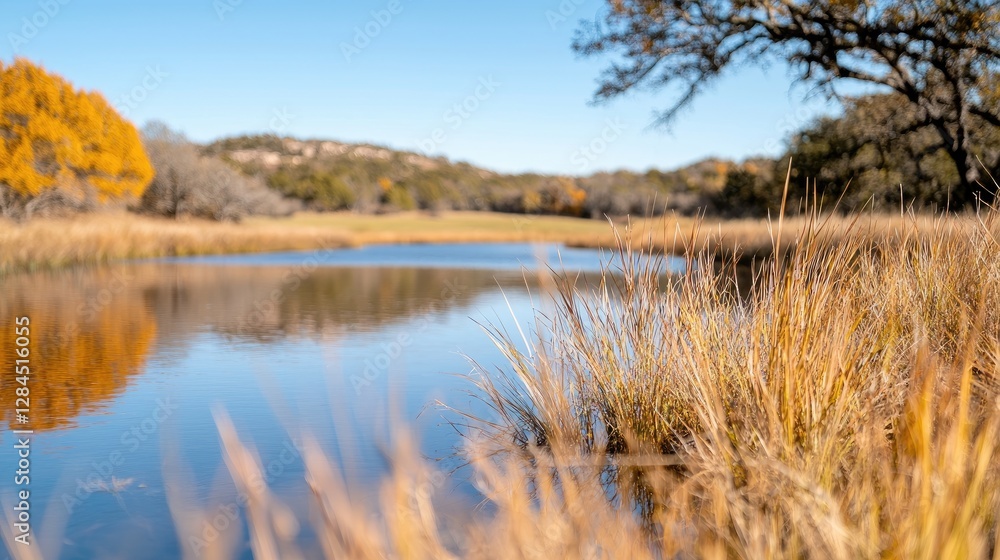 Autumnal creekside landscape, tranquil waters reflecting fall foliage, hills in background; nature photography Autumnal creekside landscape, tranquil waters reflecting fall foliage, hills in background; nature photography
