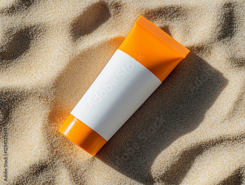 Bright and modern sunscreen tube with a vibrant orange cap, set against soft sandy textures. Ideal for sun protection, this sleek design is perfect for beach days and outdoor adventures photo