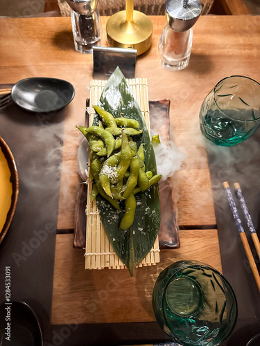 beautiful table setting for with a fog a dinner with vegetables, edamame