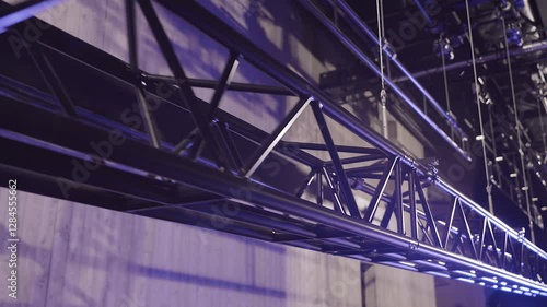 A Large Theater Truss is Slowly Lifted up with Several Sturdy Metal Cables. Lighting or Stage Truss Allows Lighting Designers the Freedom to Hang LED or Automated Fixtures, Where Ever they Choose.