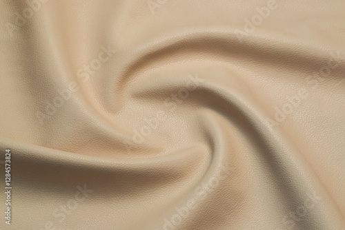 beige artificial leather with waves and folds on PVC base