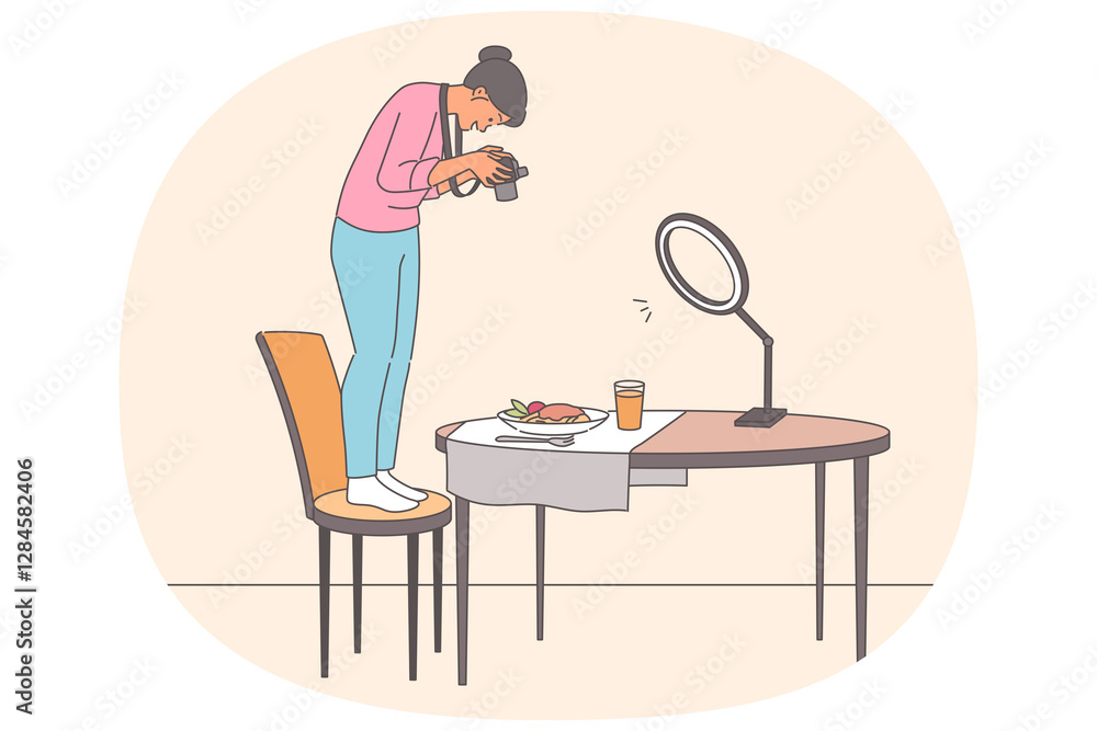 Woman takes photographs food, standing on chair to obtain pictures of dishes for restaurant menu Woman takes photographs food, standing on chair to obtain pictures of dishes for restaurant menu
