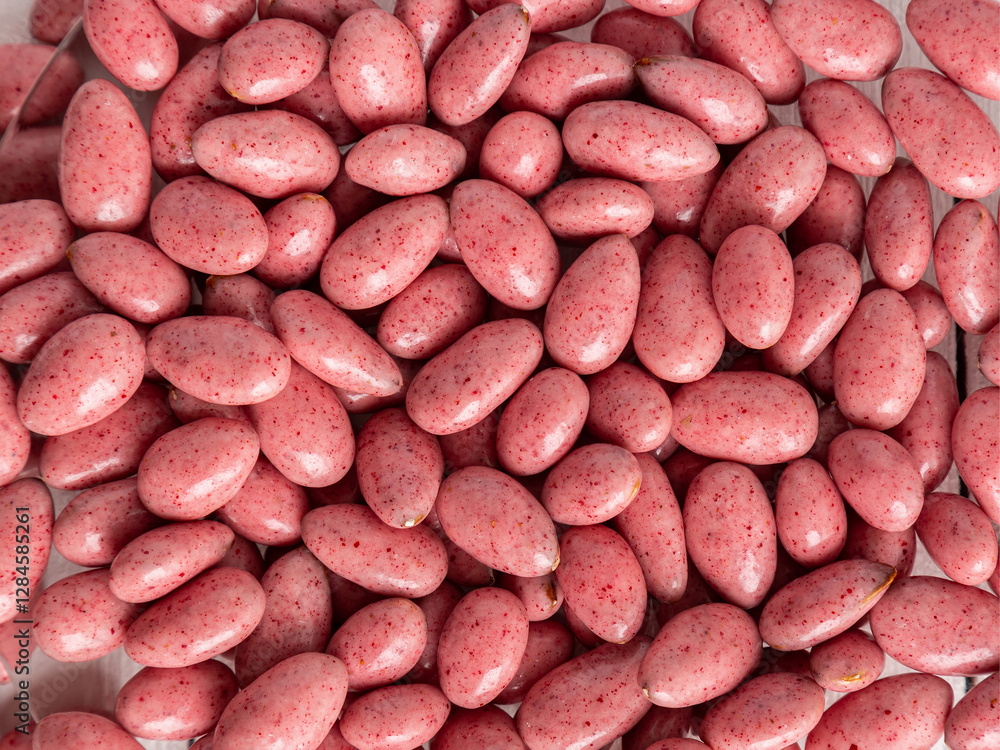 Chocolate-covered nuts in close-up. Background, texture. Lots of delicious candies close-up. Chocolate-covered nuts in close-up. Background, texture. Lots of delicious candies close-up.