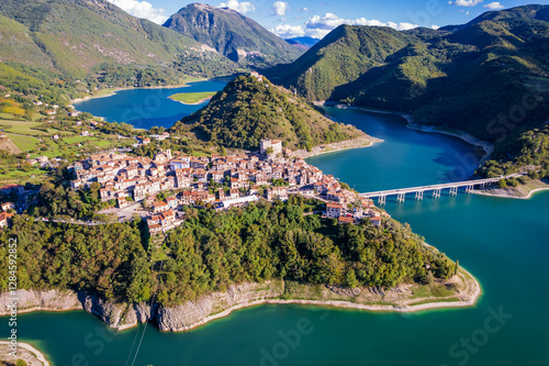 Drone view of Castel di Tora city on the shores of the artificial lake Turano  (Province of Rieti, Lazio, Italy).