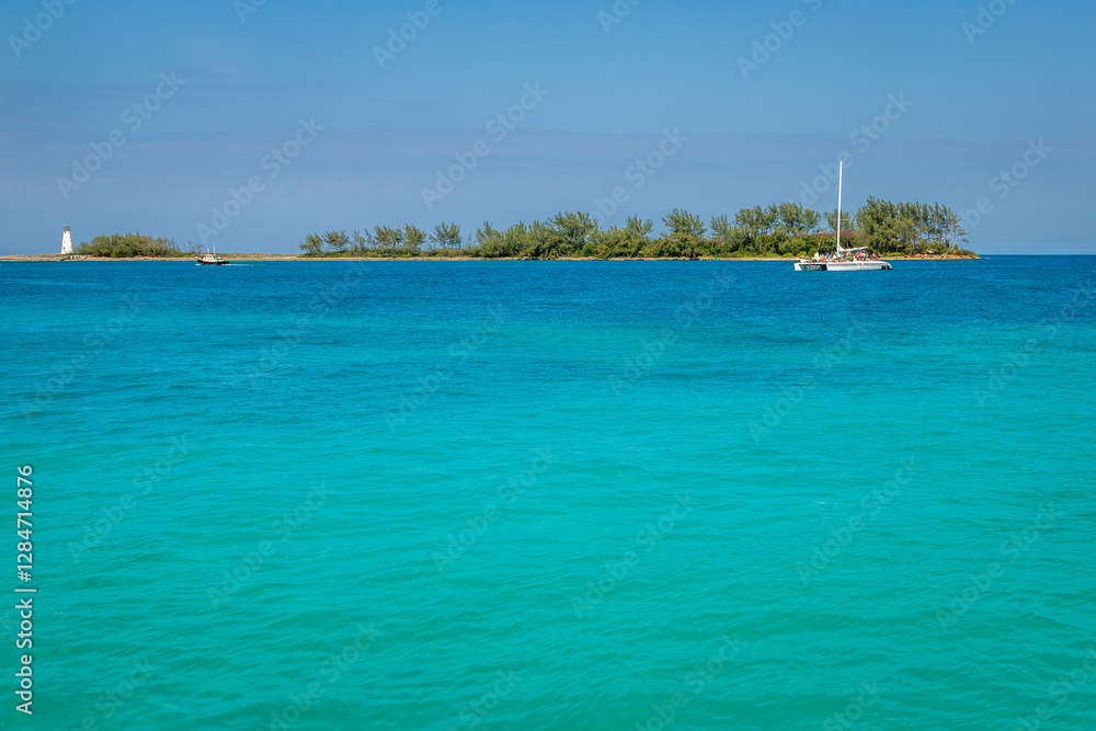 Exposure of Nassau entrance port, showing the light blue waters, the light blue is a response to sunlight reflecting off the sand and corals on the bottom, Bahamas Exposure of Nassau entrance port, showing the light blue waters, the light blue is a response to sunlight reflecting off the sand and corals on the bottom, Bahamas