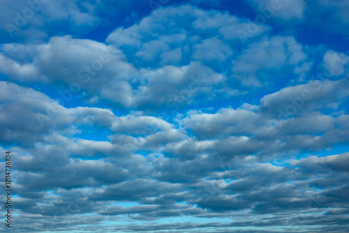 Obraz na płótnie Blue sky and lot of small clouds in middle of sunny day. No horizon is visible. w salonie