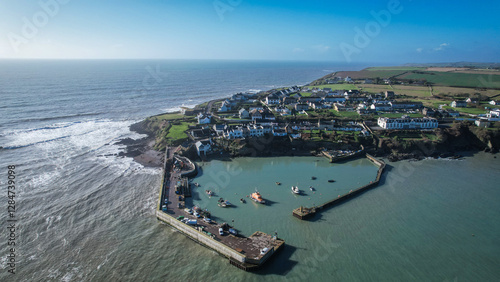 Aerial view of Ballycotton village and pier, County Cork, Ireland, showcasing the charming coastal fishing village along the rugged Atlantic shoreline