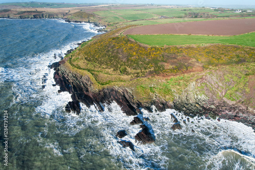 Aerial view of the Ballycotton Cliff Walk, County Cork, Ireland, showcasing the stunning coastal trail along rugged cliffs overlooking the Atlantic Ocean