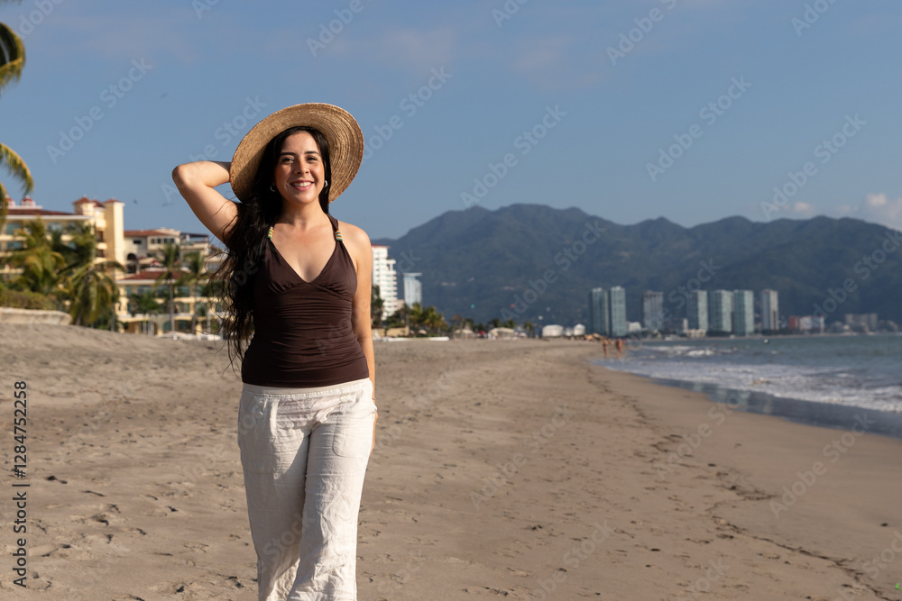 Latin woman enjoying the sun of a summer day at the beach Latin woman enjoying the sun of a summer day at the beach