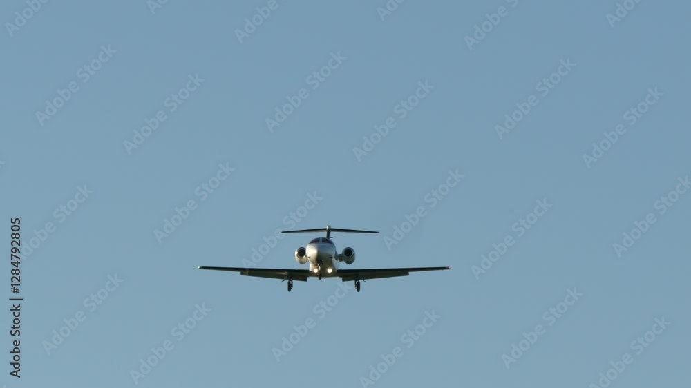A Passenger Plane Flies Highin the Sky above the Clouds A Passenger Plane Flies Highin the Sky above the Clouds