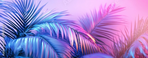 Vibrant tropical palm leaves in neon pink and blue light with soft bokeh background