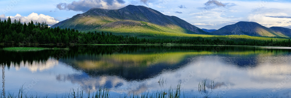 Obraz premium Sunset panorama of small lake in Siberia on background, 