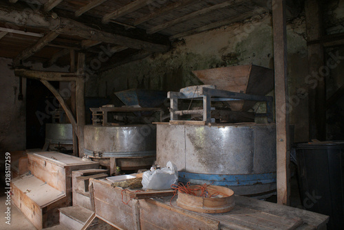 Schilderij op canvas Traditional old water mills, flour mills, made of wood and metal for producing flour and animal feed in Galician family farmhouse premises, Melide village, La Coruña, Galicia