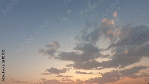 time-lapse sunset sky, cloudscape background. colorful clouds generate powerful energy and environment. wide-angle sky in the sunrise reflects on the cloudscape. peaceful nature background