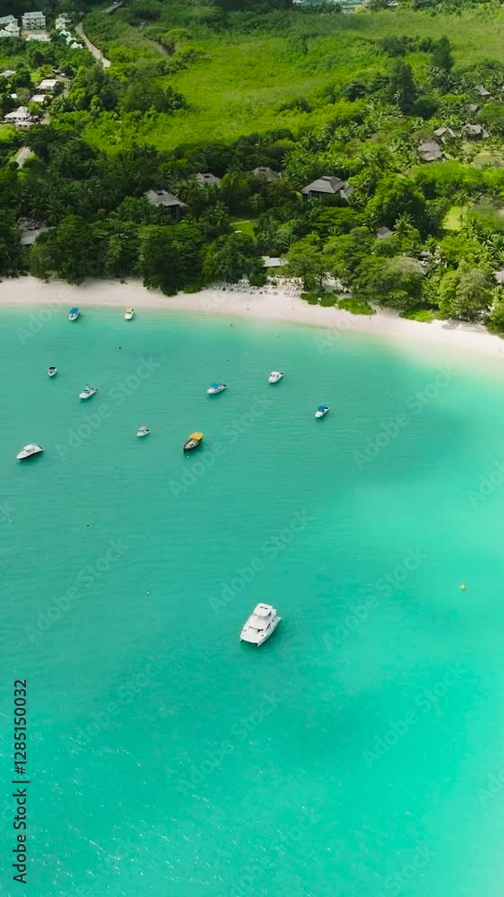 Aerial view of a turquoise bay with boats. Port Launay Beach. Seychelles. Aerial view of a turquoise bay with boats. Port Launay Beach. Seychelles.