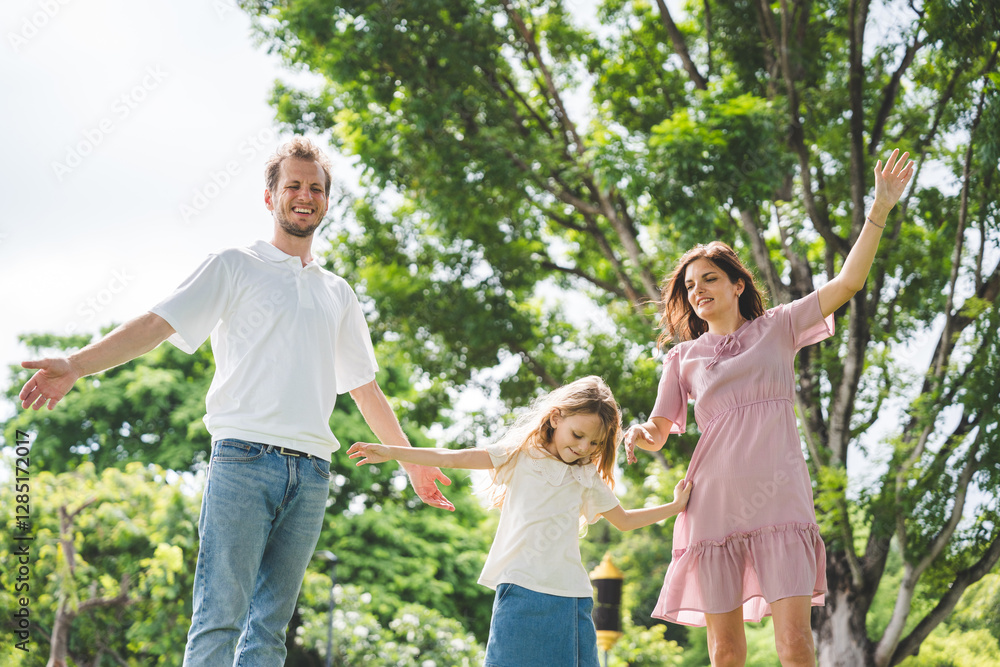 Fototapeta premium Happy family parent children having picnic outdoor activity. Enjoy happiness moment summer playing together including father mother son and daughter relaxing in the morning sunrise.